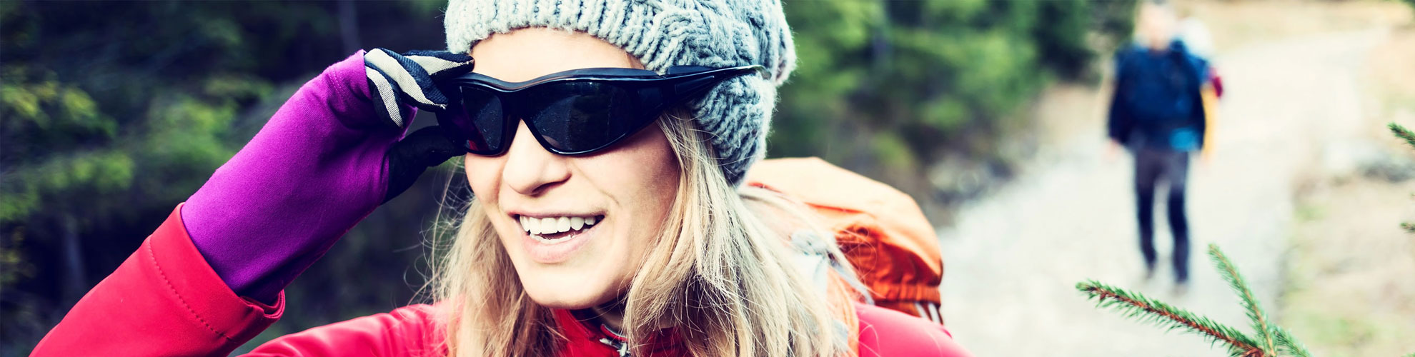 woman hiking wearing sunglasses